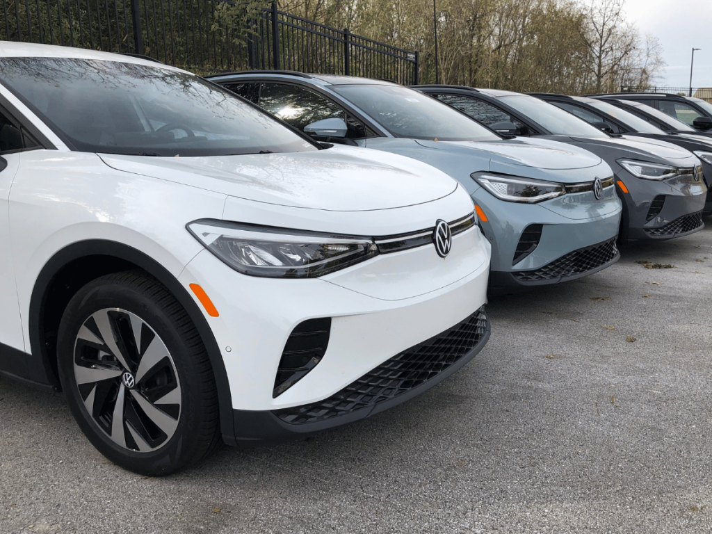 White, Blue, and Grey Volkswagen ID.4s at Volkswagen Fayetteville Car Dealership